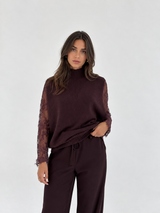 Maglia smanicata con collo alto lavorato